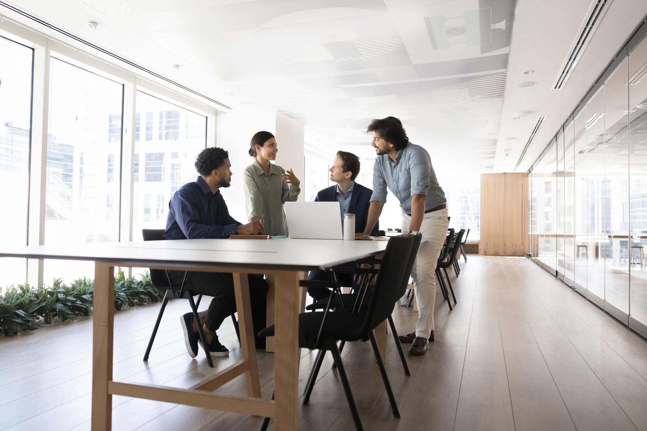 Technology consultants collaborating at a meeting table