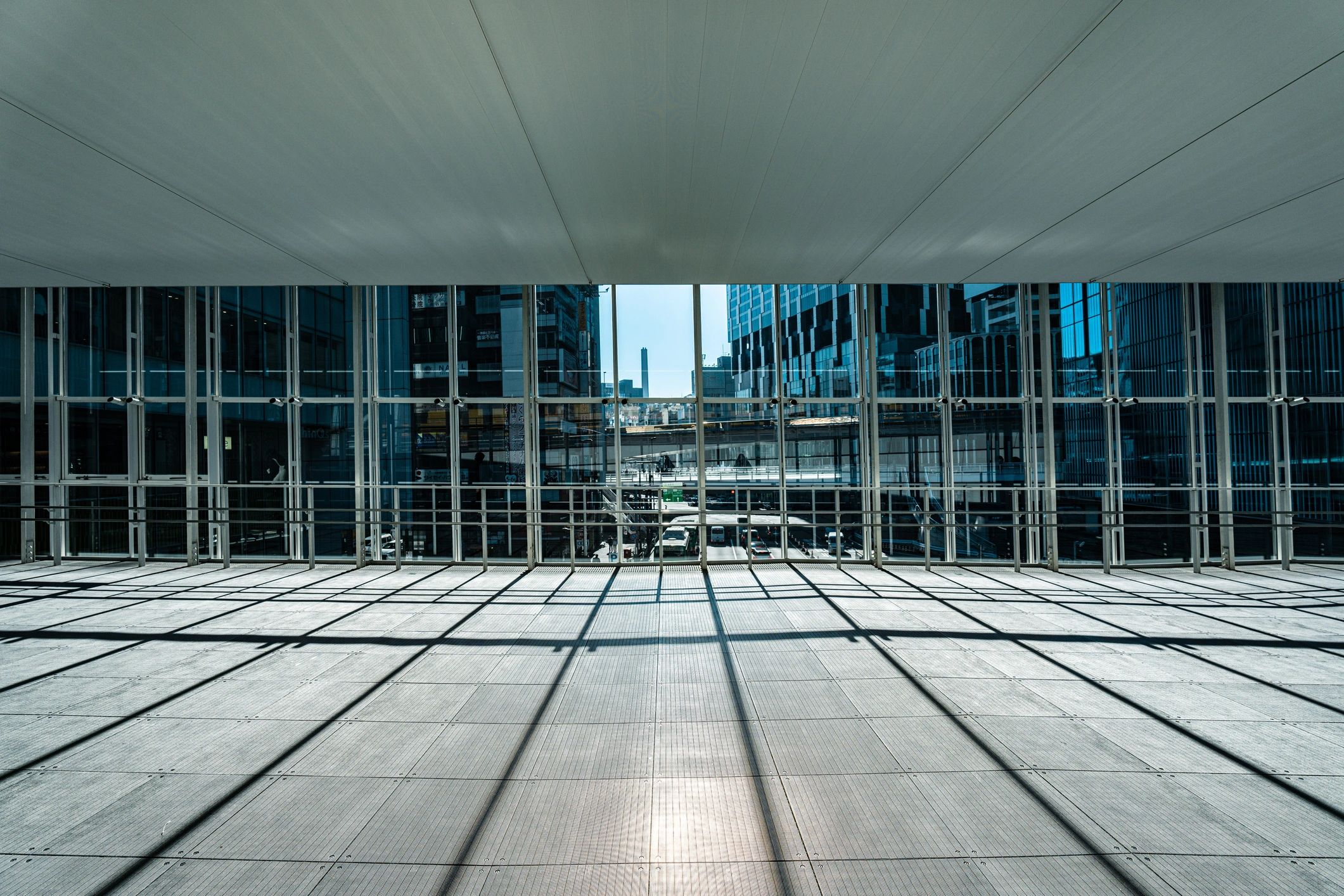Modern commercial building entrance with geometric shadows